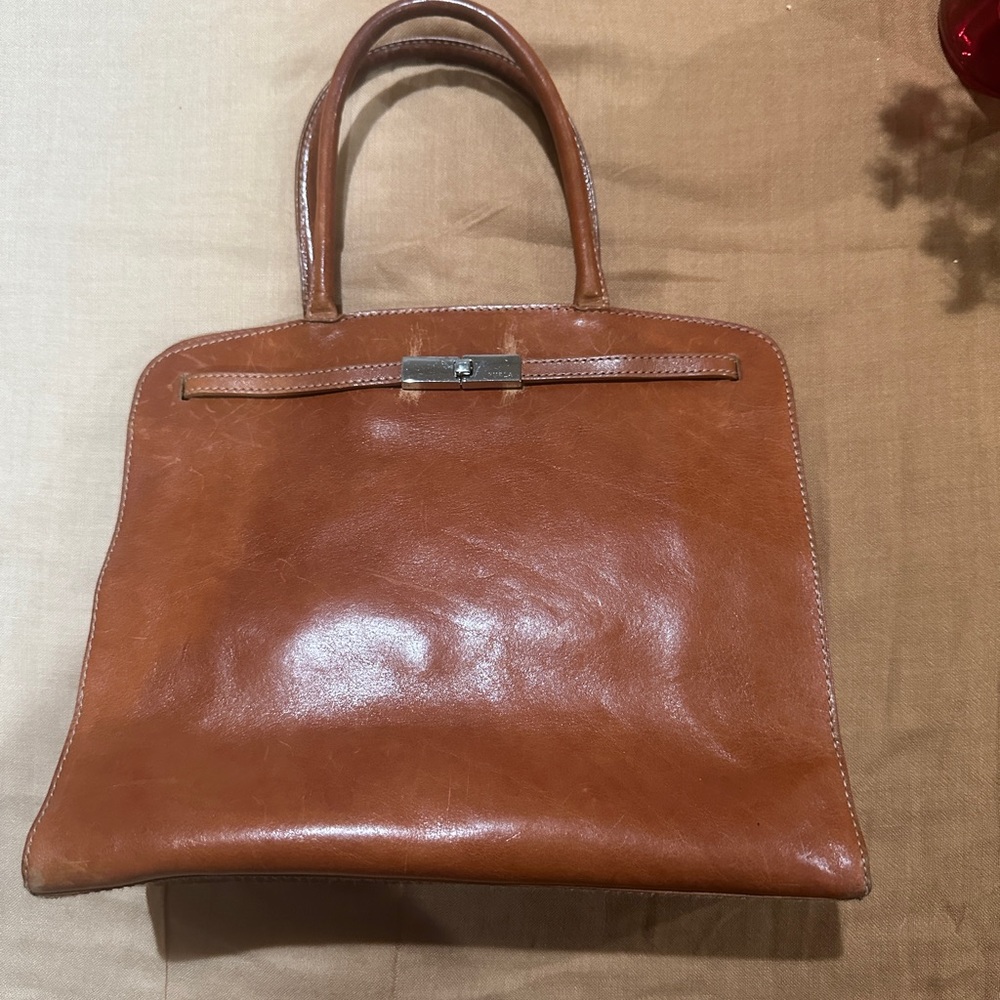 Furla small leather tote bag the shoulder strap is missing.